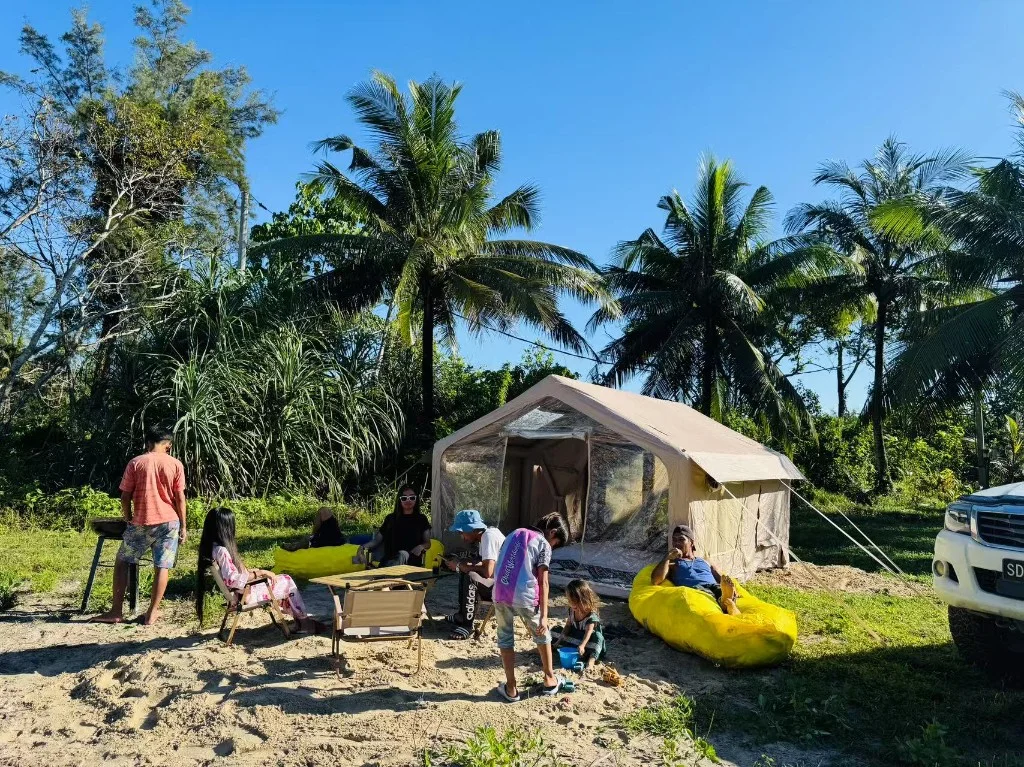 Eagle Bay Retreat tent campsite with family